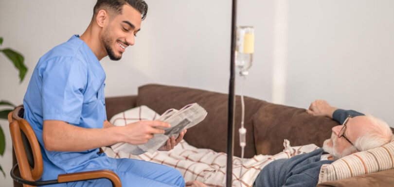 Nurse assisting elderly man at home in Chennai – post-hospital recovery, Gentle Hands Home Care caregiver supporting in-home rehabilitation, home recovery services Chennai